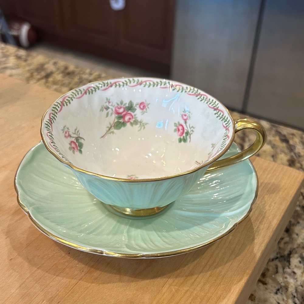 Elegant Floral Teacup and Saucer Set with Gold Trim